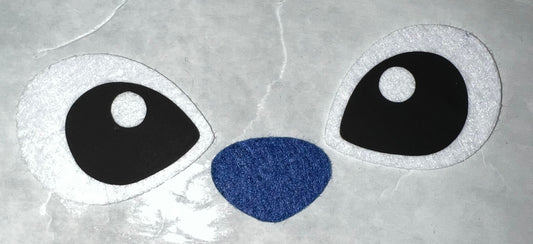 Big blue and pink alien eyes. Not baby Alien